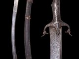 a close up of two swords on a black background
