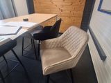 two chairs and a table in the corner of a room