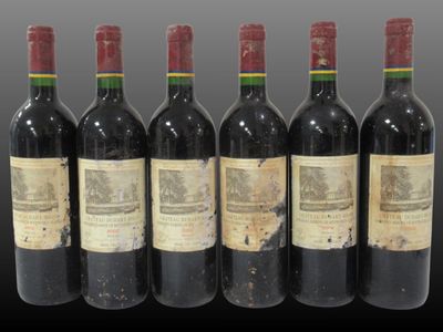 six bottles of wine are lined up in a row on a table