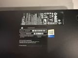 the back of a laptop with a sticker on the side of it