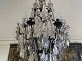 a chandelier hanging from the ceiling in a living room