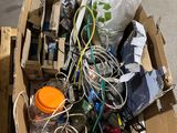 a cardboard box full of electronic equipment on the street