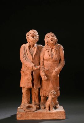 une image représentant une statue d'un homme et d'une femme accompagnés d'un chien