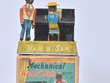toy figurines of a man and a woman standing on top of a box