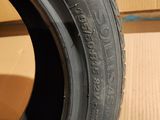 tire on a cardboard box with a cardboard box in the background