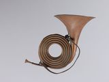 a wooden instrument that is hanging from the ceiling