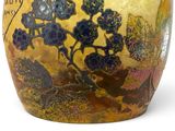 a vase that has a picture of a tree on it