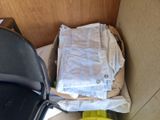 a chair and a table with a bag on it