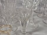 a lot of wine glasses sitting on a table