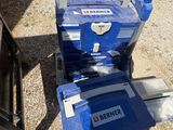 a blue and white lawn mower and a blue and white lawn mower and a blue and white lawn mower and a red and yellow and a