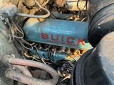 a close up of an old blue motorcycle engine