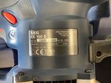 an image of a close up of a sanding machine on a table