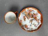 a plate and a cup sitting on a table