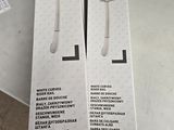 emballage d'une paire de télécommandes Wii posées sur une table