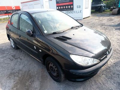 a picture of a small black car parked in a lot
