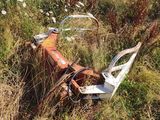 an old rusted motorcycle sitting in the middle of a field