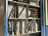 a metal cabinet with a bunch of tools inside of it