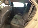 the back seats of a car are empty and the passenger seat is empty