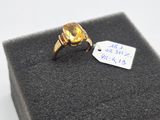 une image représentant une bague en or sertie d'une citrine