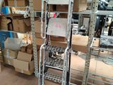 a metal rack with boxes on it in a warehouse