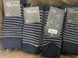 six pairs of men ' s blue and white striped socks in a box
