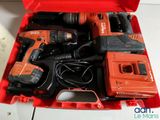 a red tool box with tools in it on a table