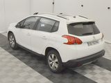 a white car that is parked in a garage