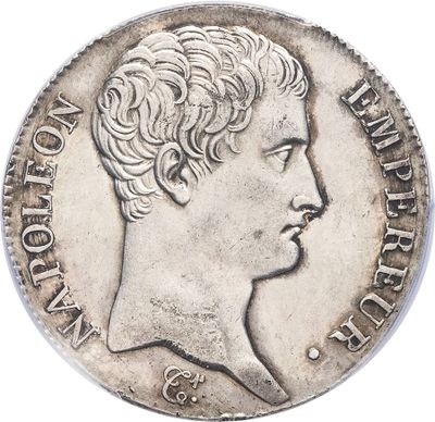 a silver coin with a woman ' s face on it