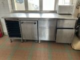 a large stainless steel kitchen with a microwave and a dishwasher