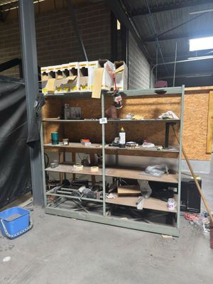 a room that has a shelf with a lot of items on it