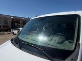 a white car that is parked in a parking lot