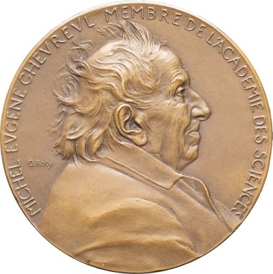 une image représentant une médaille d'or sur laquelle figure le visage d'un homme