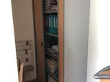 a book shelf that has a bunch of books on it