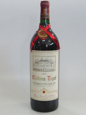 a bottle of wine that is sitting on a table