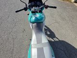 a motor scooter parked on the side of the road