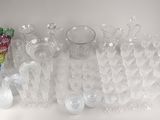 a lot of glass vases that are sitting on a table