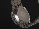 a watch that is sitting on a metal bracelet