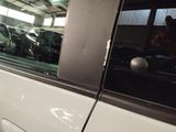 a dog that is sitting in the passenger seat of a car