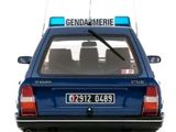 a small blue car with a sign on the back of it