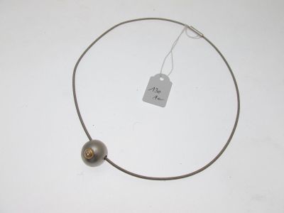 an image of a necklace with a tag on it