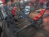 a large gym with a lot of machines in it