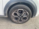 a close up of a car ' s tire on the street