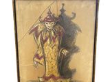 une vieille photo représentant un clown tenant une épée, posée sur un socle