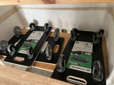 a lot of different types of skateboards sitting on a shelf