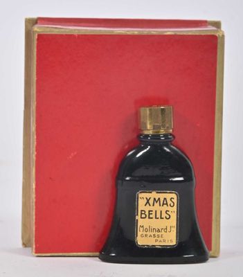 an image of a bottle of perfume sitting in front of a box