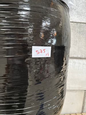 a large black container with a sticker on it