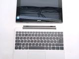 two laptops sitting side by side on a white table
