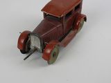 a toy car that is sitting on a white surface