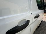 a white van that is parked on the side of the road