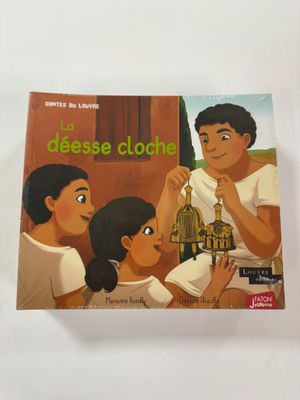un livre sur lequel figure la photo d'un homme et d'une femme devant une maison
